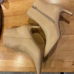 JustFab Ally Pointed Toe Stiletto Ankle Booties in Beige